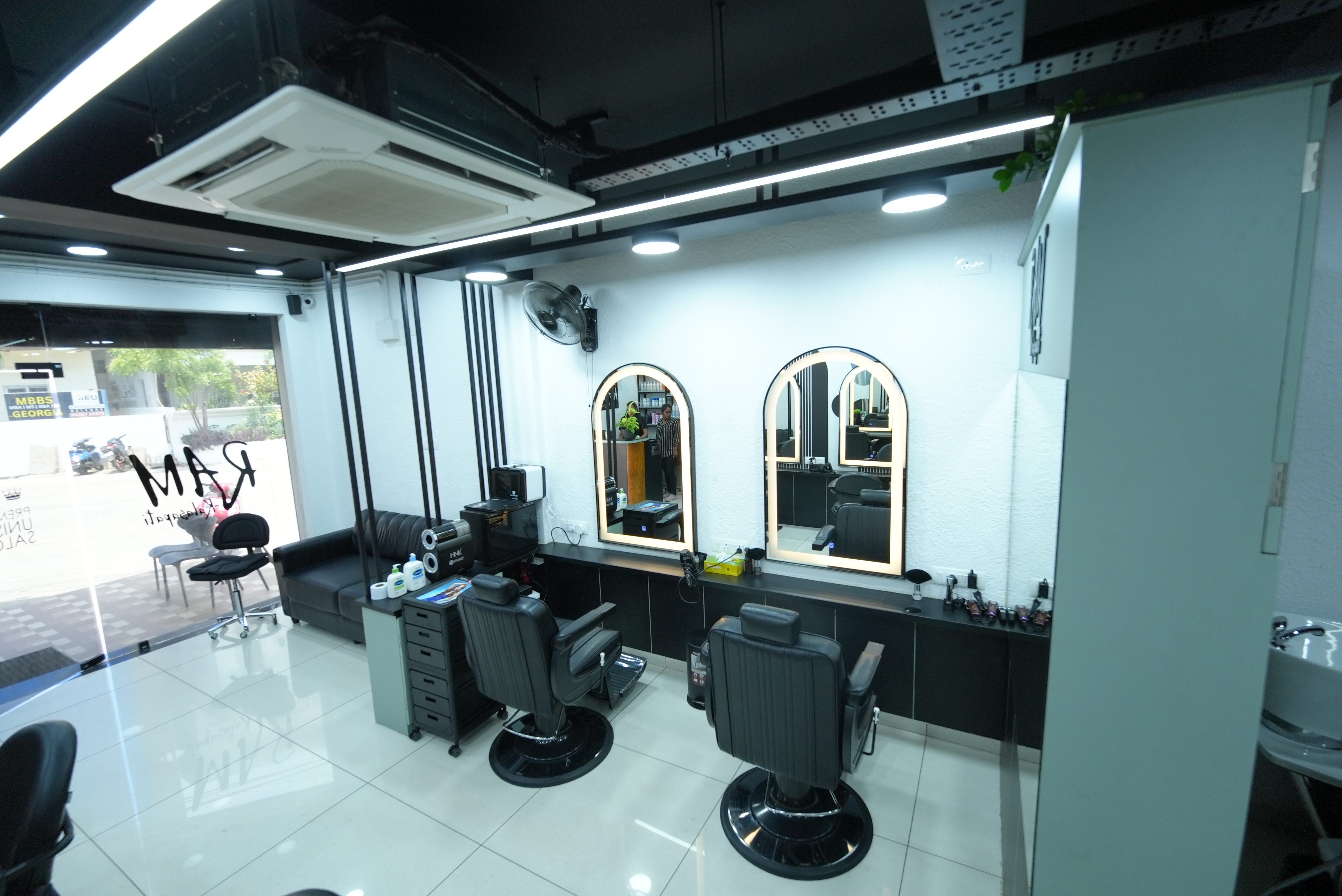RAM KALASAPATI styling floor with mirrors and salon workstations