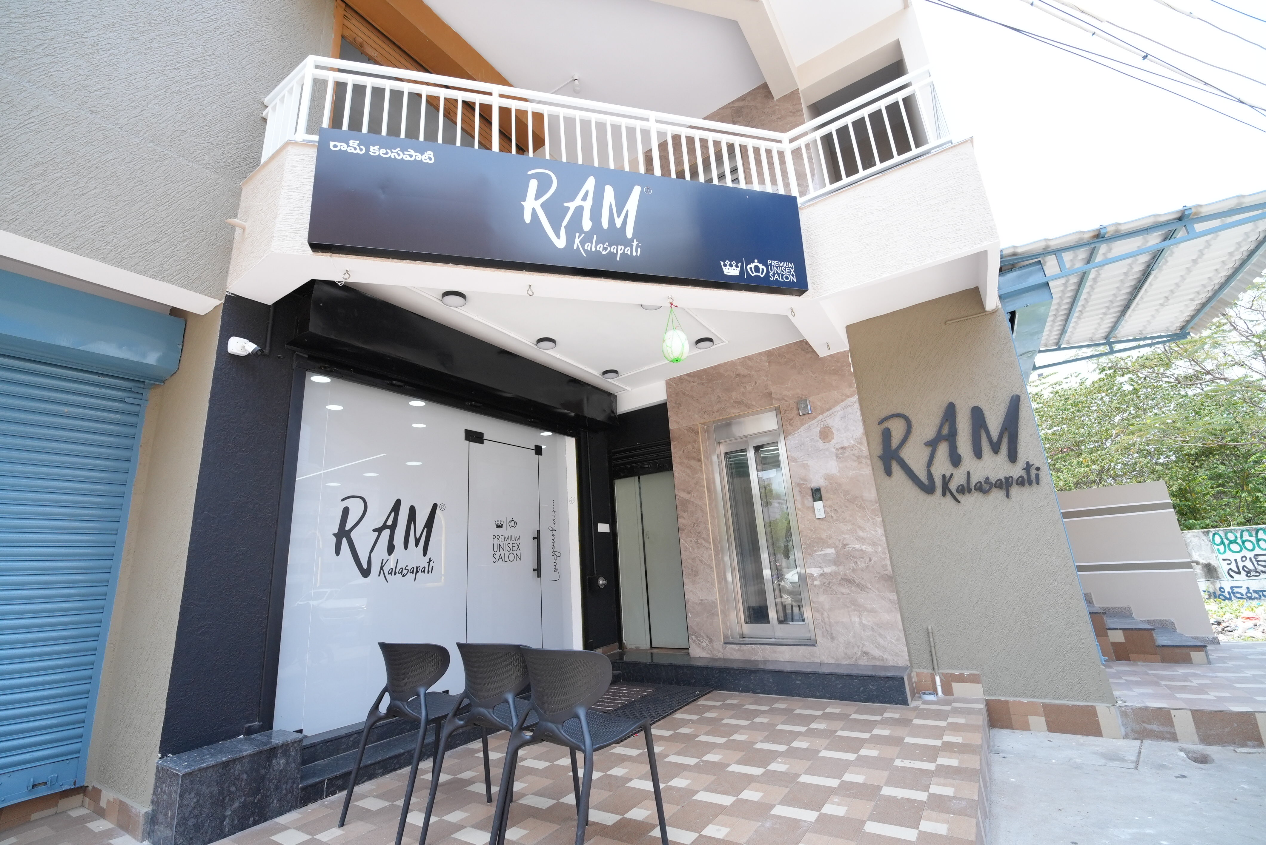 RAM KALASAPATI storefront with salon signage and glass entrance