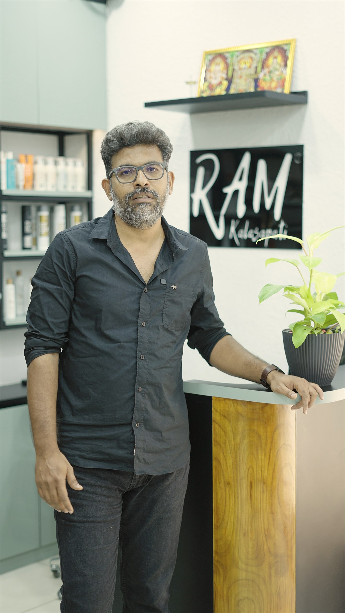 Ram Kalasapati standing inside the salon